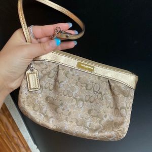 Gold coach wristlet